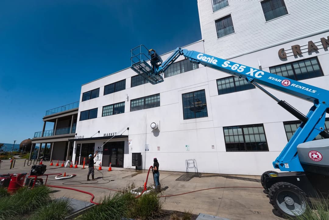 Pressure washing a commercial building