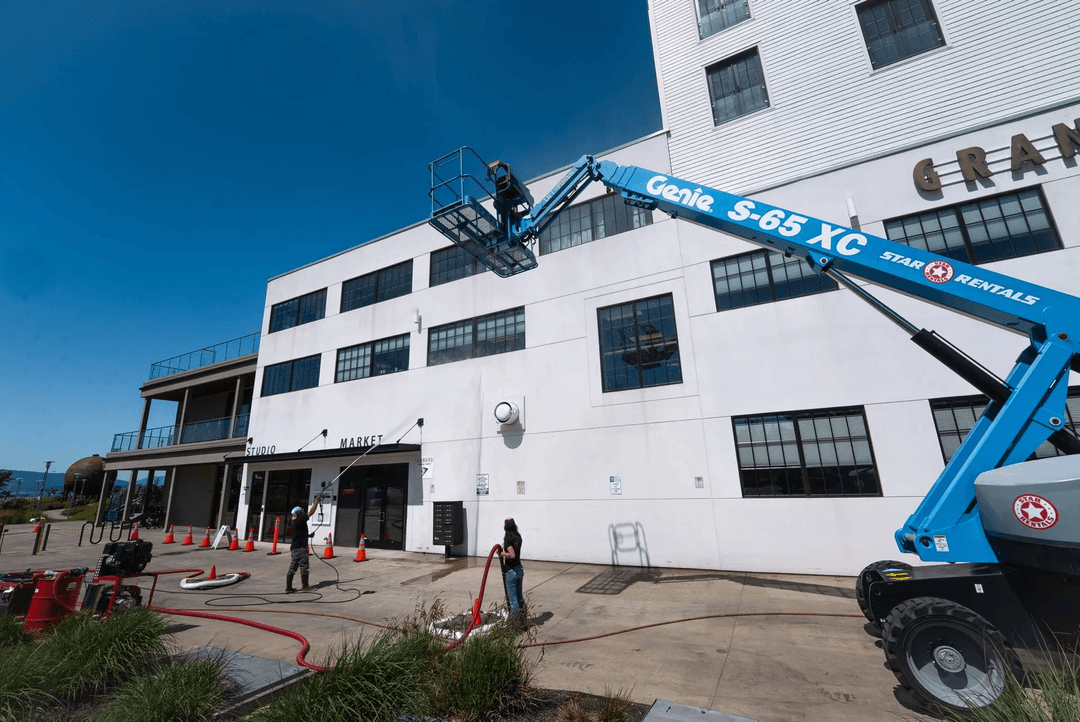 Pressure washing a commercial building