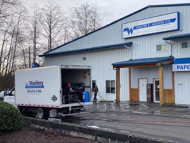 Pressure washing a commercial building